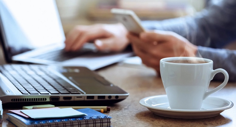 Coffee cup on office desk workspace